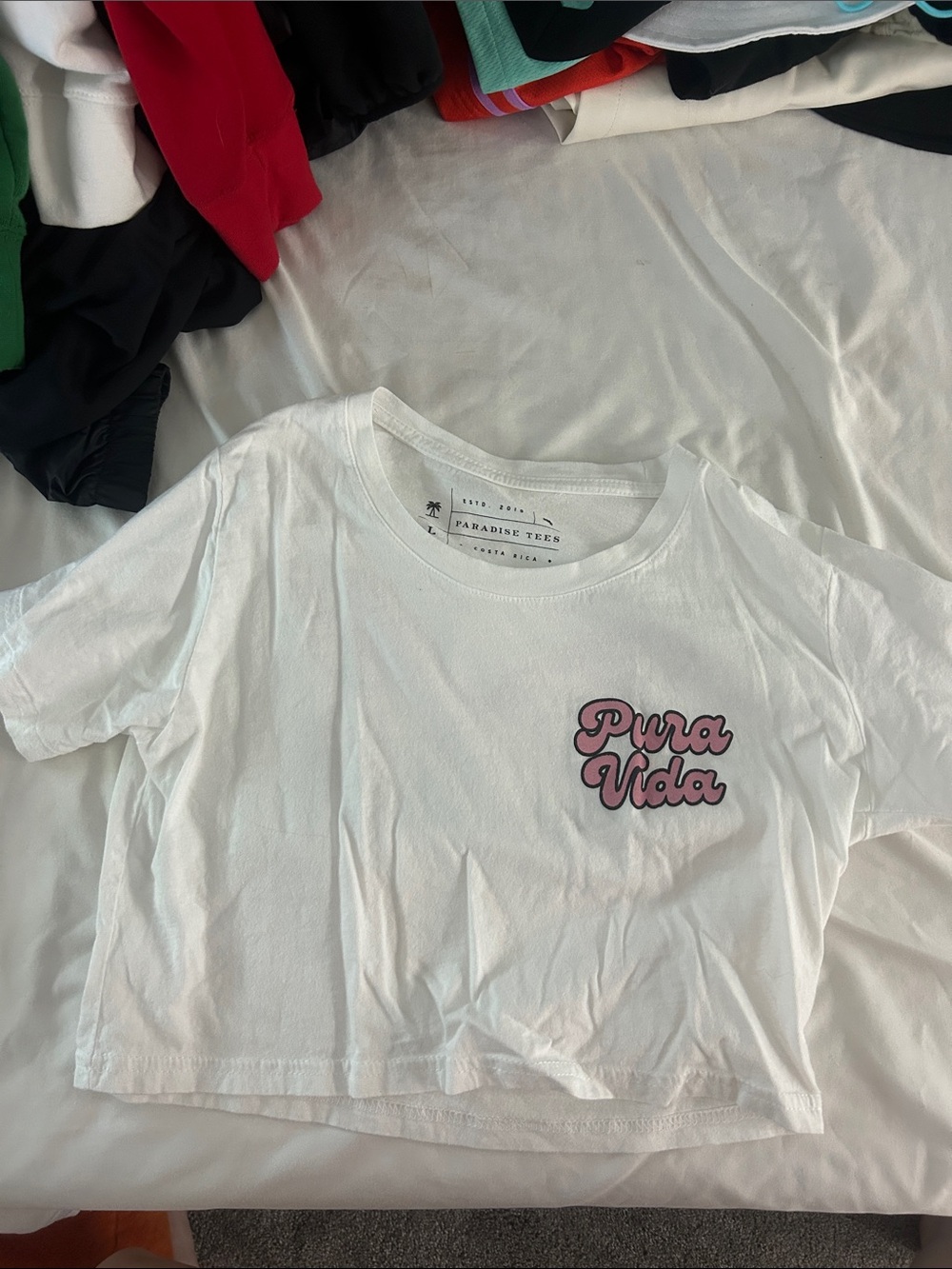 Pura Vida White Tee with Pink Script Logo and Butterfly Wings on Back